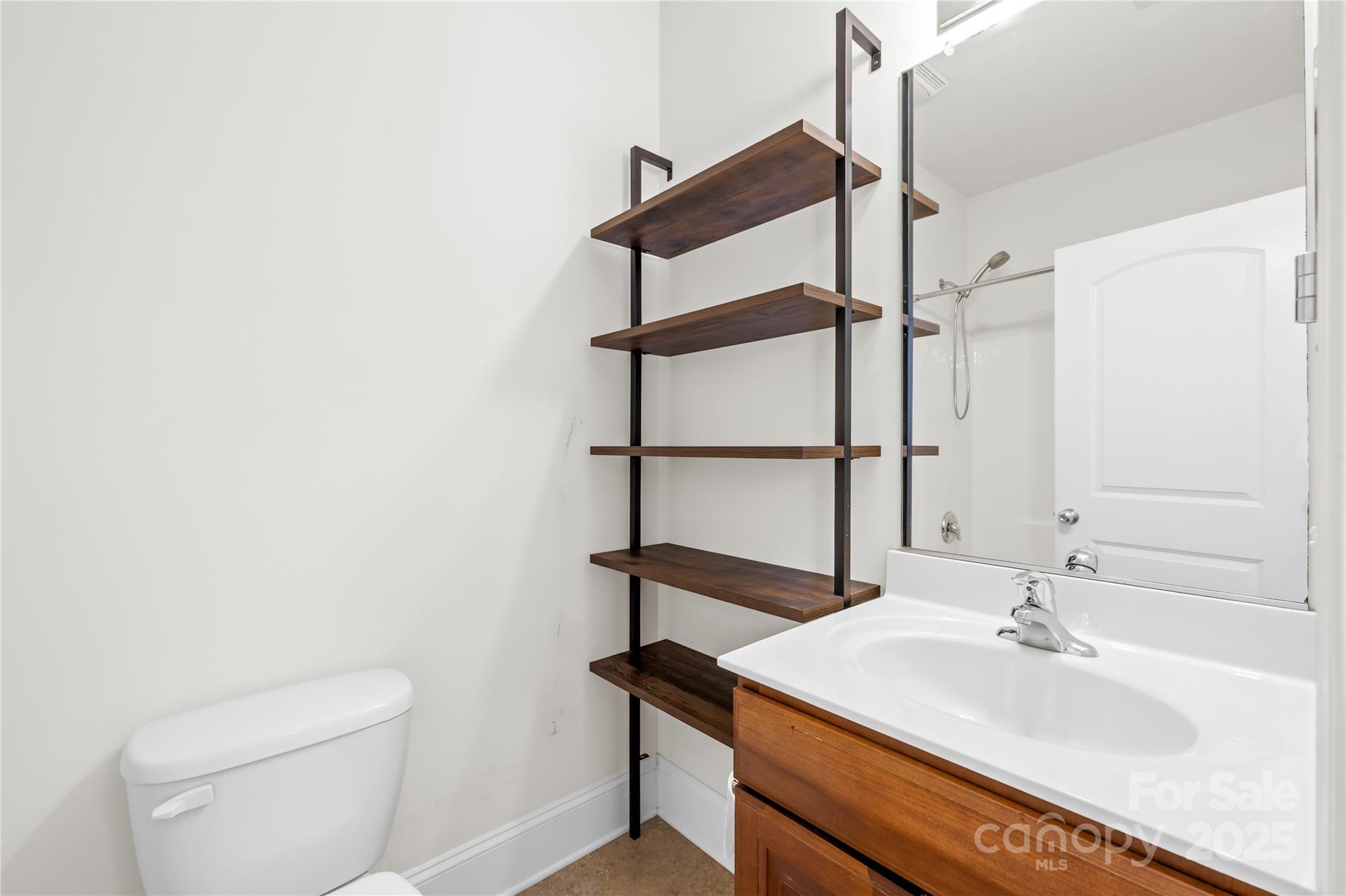 518 Armour Street Davidson, NC 28036 - Photo 8 of 26 a bathroom with a sink a toilet and shower