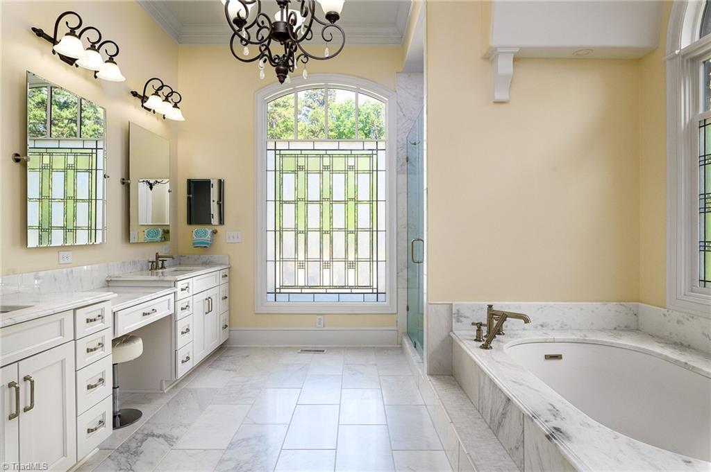 1350 Kilkenny Lane Rural Hall, NC 27045 - Photo 18 of 49 Fully renovated primary bathroom with exquisite Italian marble, heated floors & smart commode