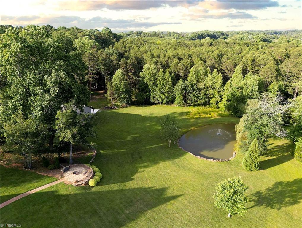 1350 Kilkenny Lane Rural Hall, NC 27045 - Photo 47 of 49 Arial view of the back of the property, fire pit and pond with beautiful fountain