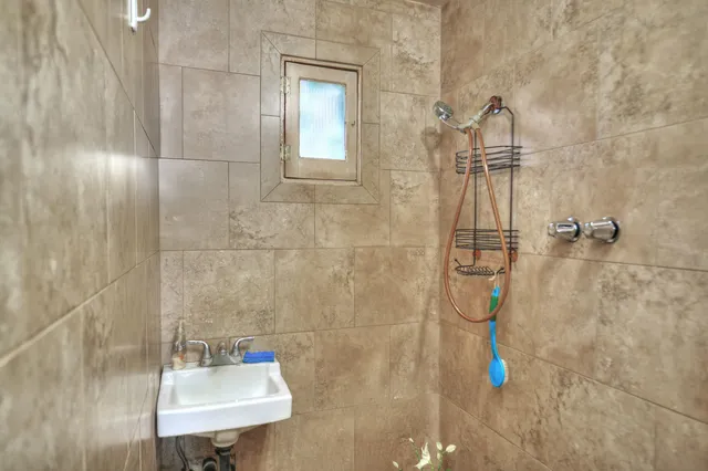 a front view of house along with deck and outdoor space