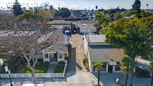 an aerial view of residential houses with outdoor space
