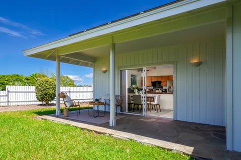 a view of an house with backyard porch and furniture