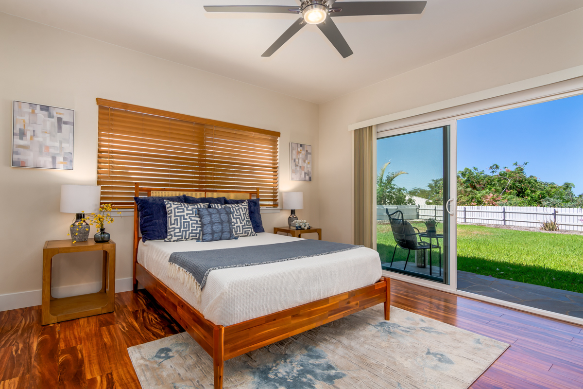 68-1704 Akaula Court Waikoloa, HI 96738 - Photo 16 of 30 a bed sitting in a bedroom next to a window