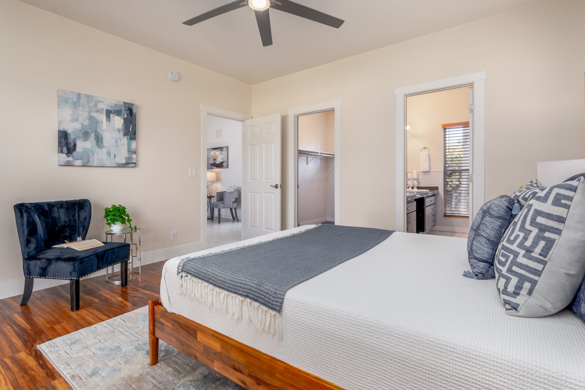 68-1704 Akaula Court Waikoloa, HI 96738 - Photo 18 of 30 a bedroom with a bed and a chair