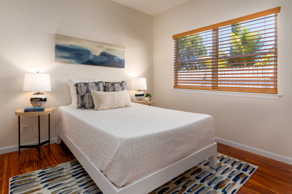 68-1704 Akaula Court Waikoloa, HI 96738 - Photo 19 of 30 a bedroom with a bed and wooden floor
