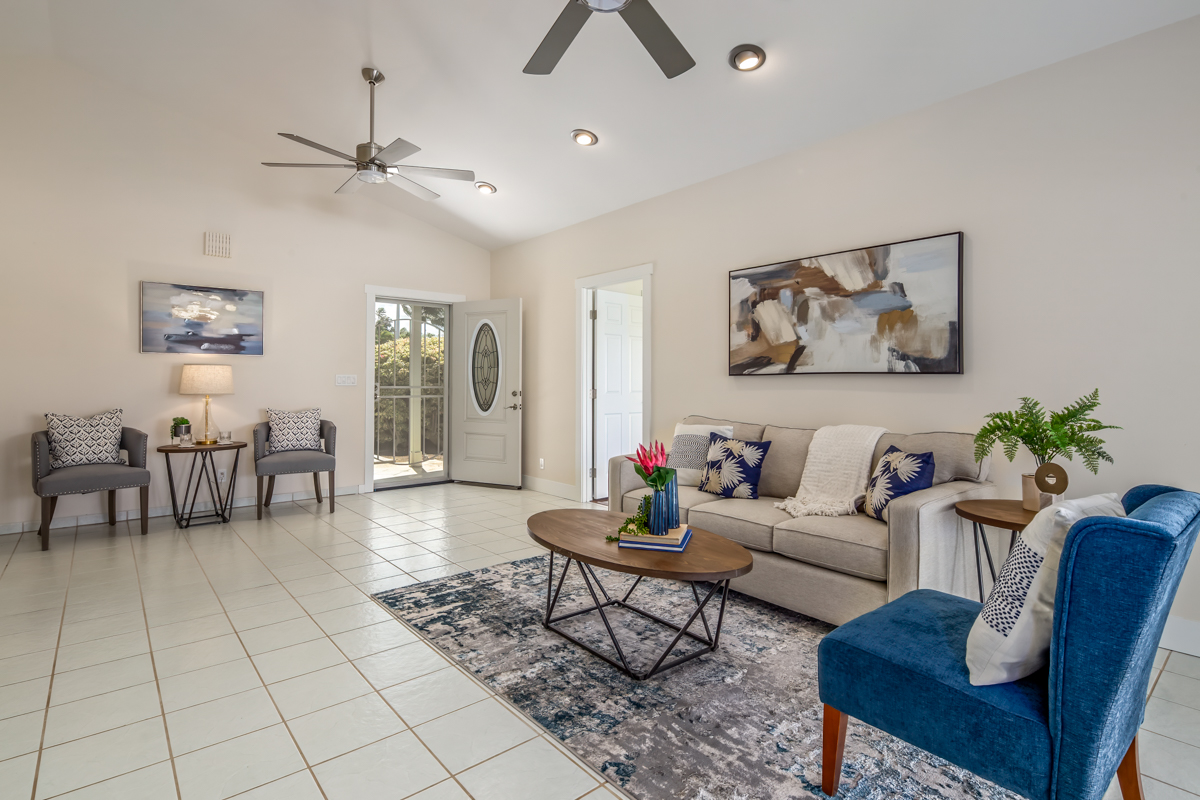 68-1704 Akaula Court Waikoloa, HI 96738 - Photo 2 of 30 a living room with furniture and a chandelier