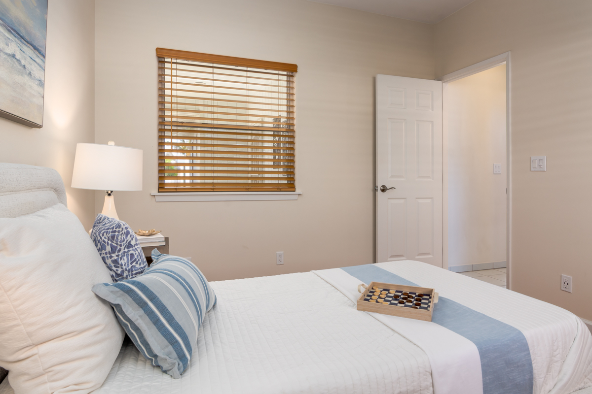 68-1704 Akaula Court Waikoloa, HI 96738 - Photo 23 of 30 a bedroom with a bed and a window