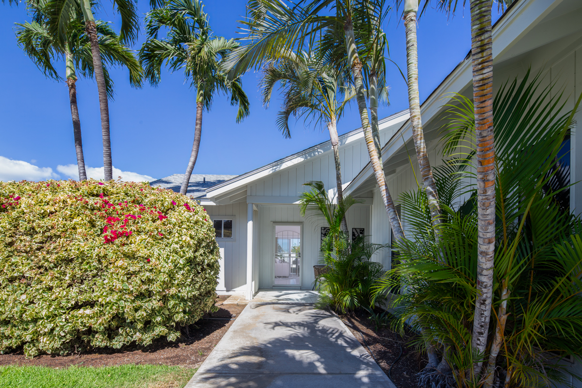 68-1704 Akaula Court Waikoloa, HI 96738 - Photo 3 of 30 a front view of a house with a garden