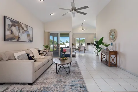 a living room with furniture and a clock