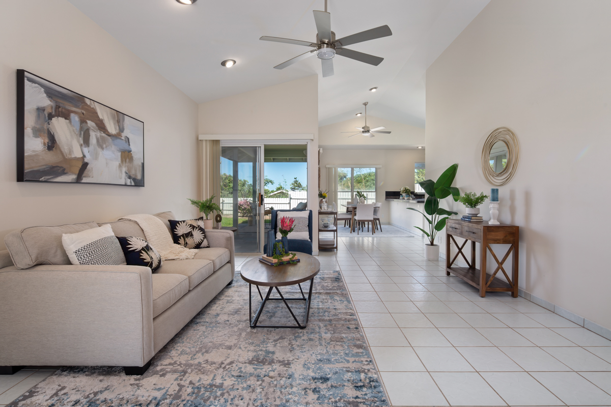 68-1704 Akaula Court Waikoloa, HI 96738 - Photo 5 of 30 a living room with furniture and a clock