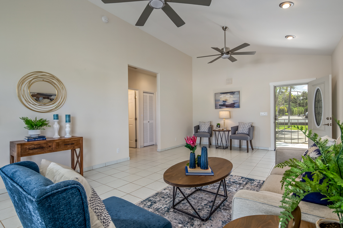 68-1704 Akaula Court Waikoloa, HI 96738 - Photo 7 of 30 a living room with furniture and a potted plant