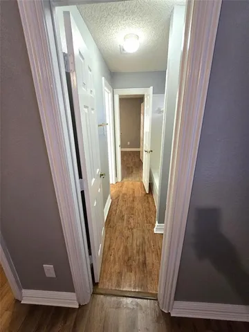 an entryway with a mirror