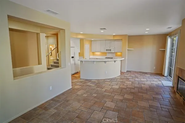 a view of kitchen and a window