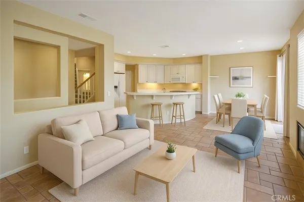 a living room with furniture and a table