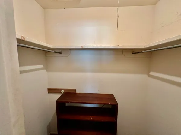 a small space with water heater on the wall