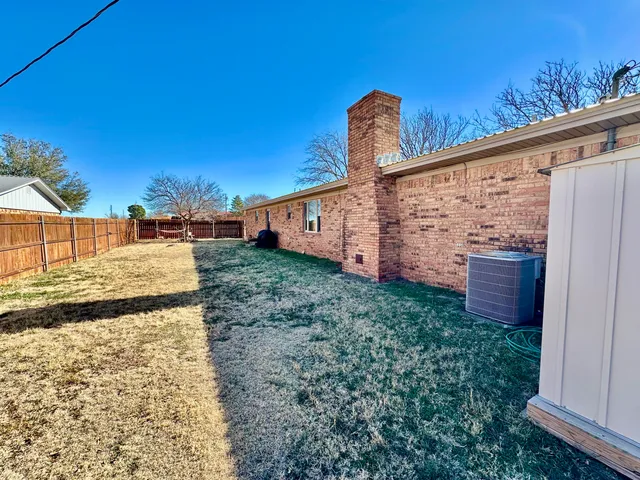 a view of a back yard from a balcony