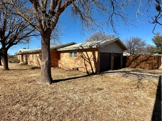 a view of a backyard of a house
