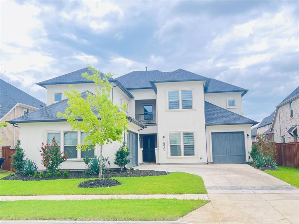 6825 Entwistle Road Frisco, TX 75034 - Photo 1 of 33 a front view of a house with a yard and garage