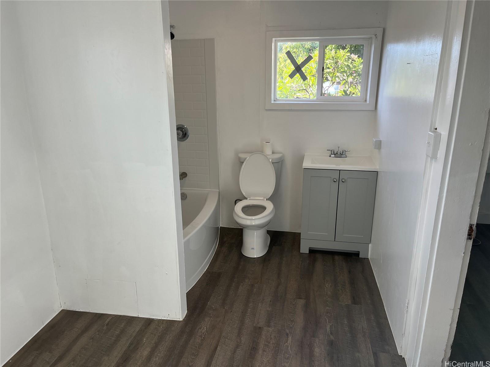 85-824 Lihue Street Waianae, HI 96792 - Photo 12 of 21 a bathroom with a toilet and a sink