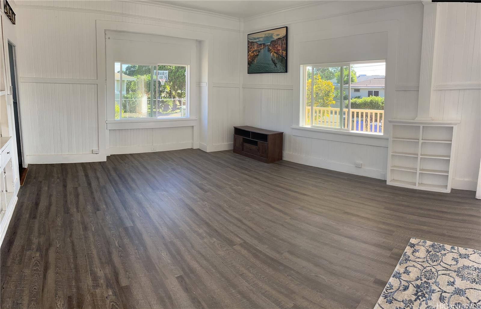 85-824 Lihue Street Waianae, HI 96792 - Photo 17 of 21 wooden floor in an empty room with a window