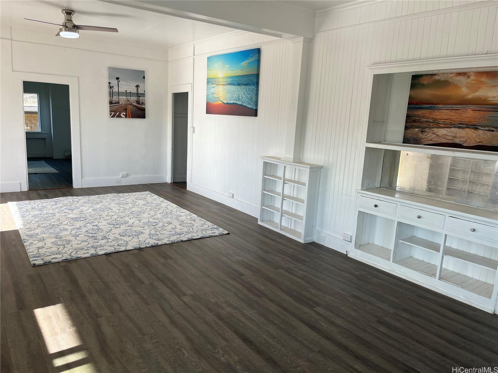 85-824 Lihue Street Waianae, HI 96792 - Photo 2 of 21 wooden floor with cabinet and mirror