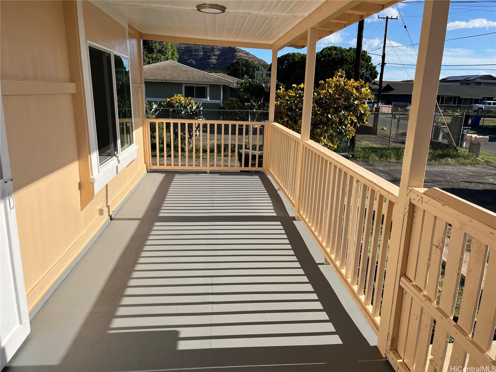 85-824 Lihue Street Waianae, HI 96792 - Photo 4 of 21 a view of a balcony with wooden floor