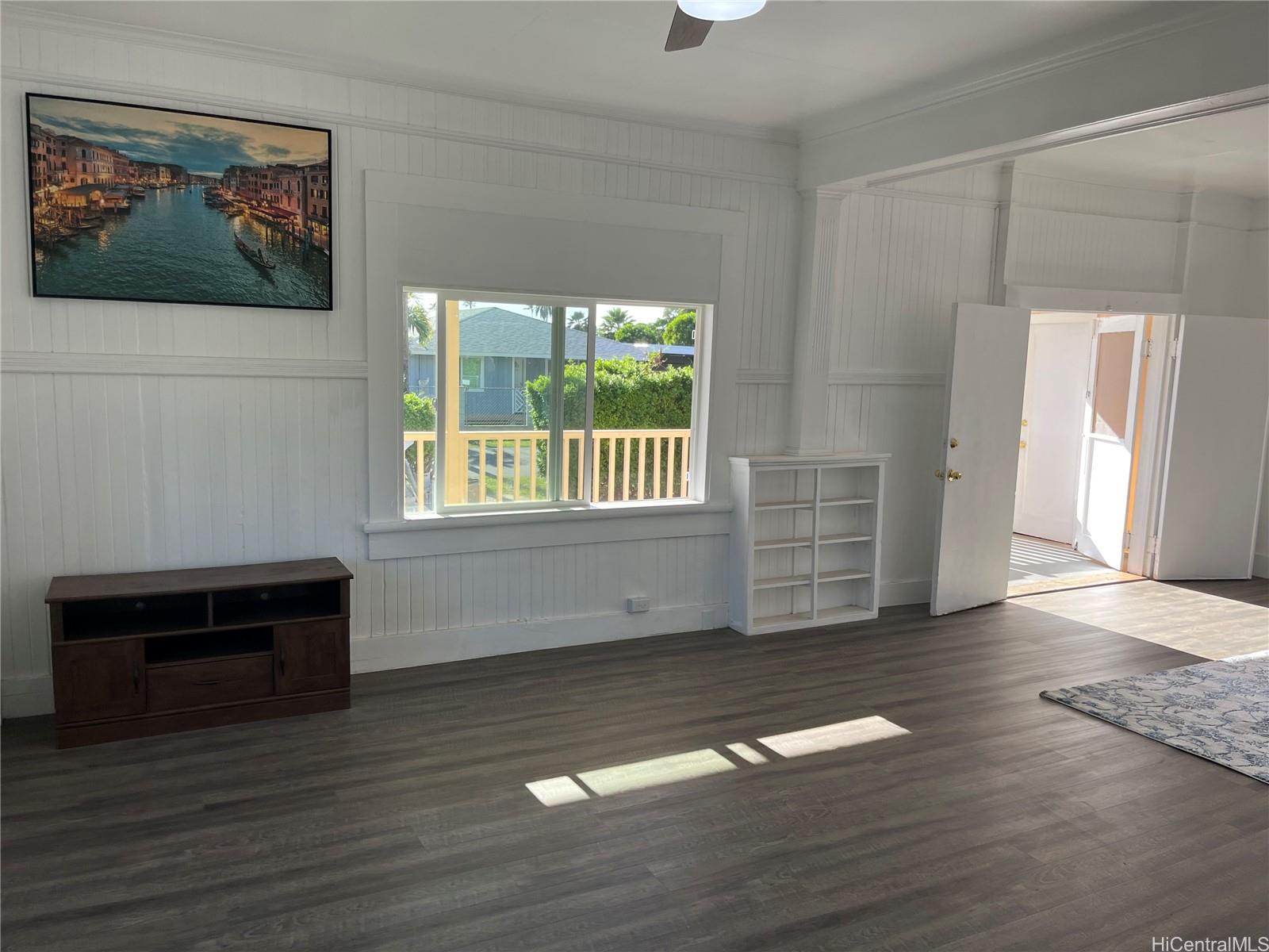 85-824 Lihue Street Waianae, HI 96792 - Photo 8 of 21 an empty room with wooden floor and windows