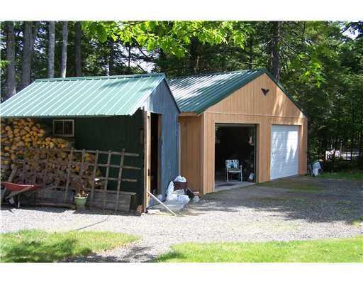 389 Manhanock Pond Road Sangerville, ME 04479 - Photo 5 of 20 Parking Lot/Garage. Two car garage...