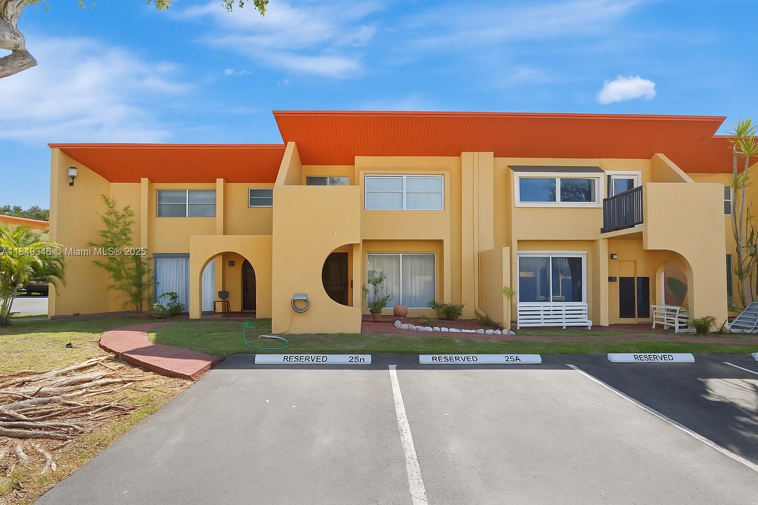 13731 Southwest 84th Street, Unit B Miami, FL 33143 - Photo 1 of 13 a front view of building with yard