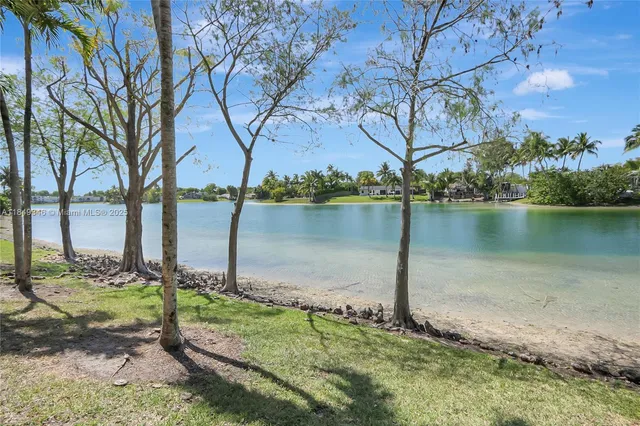 a view of a lake with a yard
