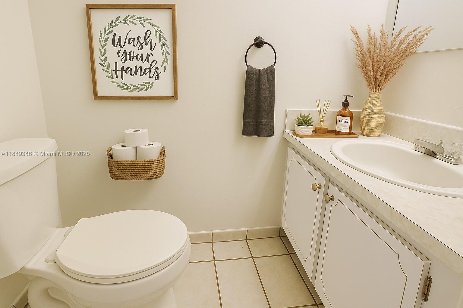 13731 Southwest 84th Street, Unit B Miami, FL 33143 - Photo 8 of 13 a bathroom with a toilet sink and mirror