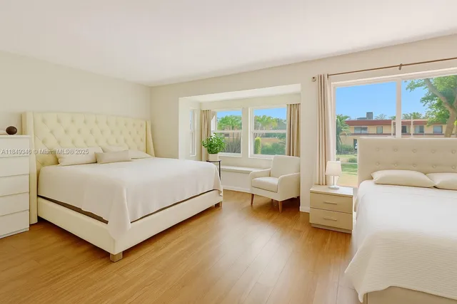 a bedroom with a large bed and a couch