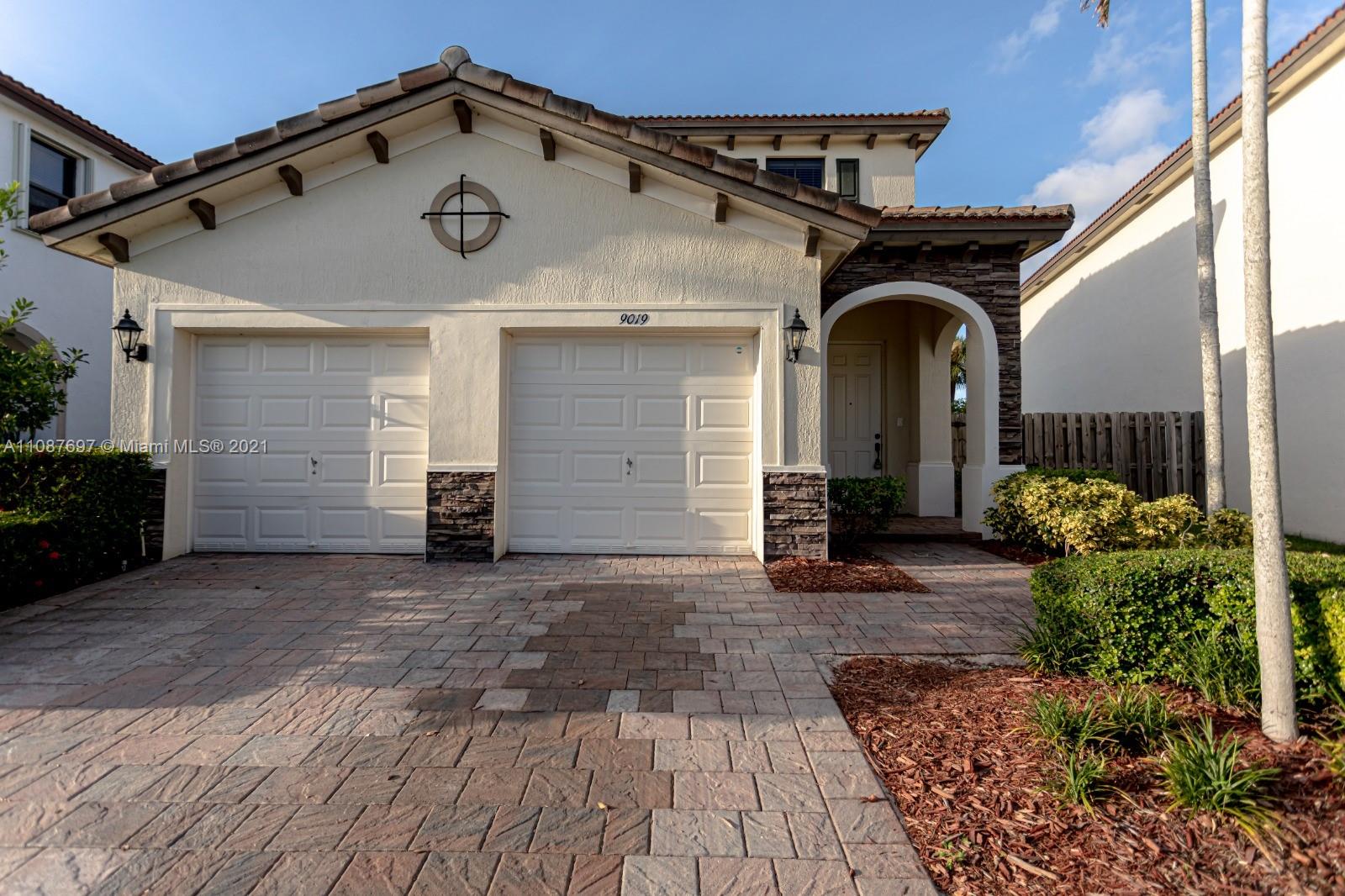 9019 Southwest 227th Terrace Cutler Bay, FL 33190 - Photo 1 of 9 a view of a house with a outdoor space