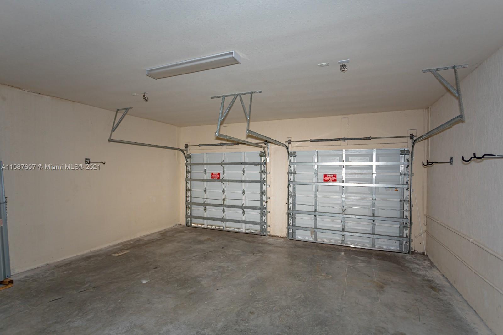 9019 Southwest 227th Terrace Cutler Bay, FL 33190 - Photo 2 of 9 a view of a garage