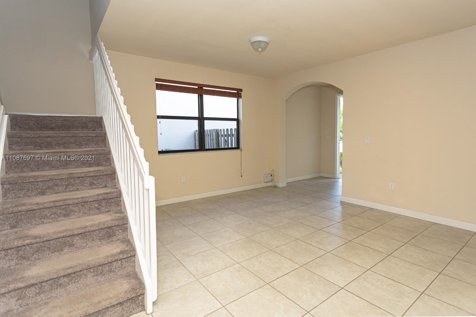 9019 Southwest 227th Terrace Cutler Bay, FL 33190 - Photo 8 of 9 a view of an entryway with staircase