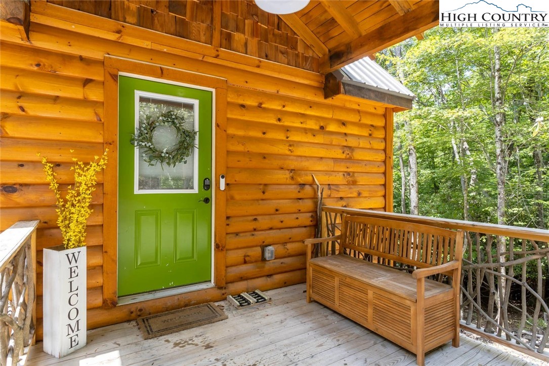 141 Rhododendron Drive Beech Mountain, NC 28604 - Photo 2 of 27 a view of a two chairs in the balcony
