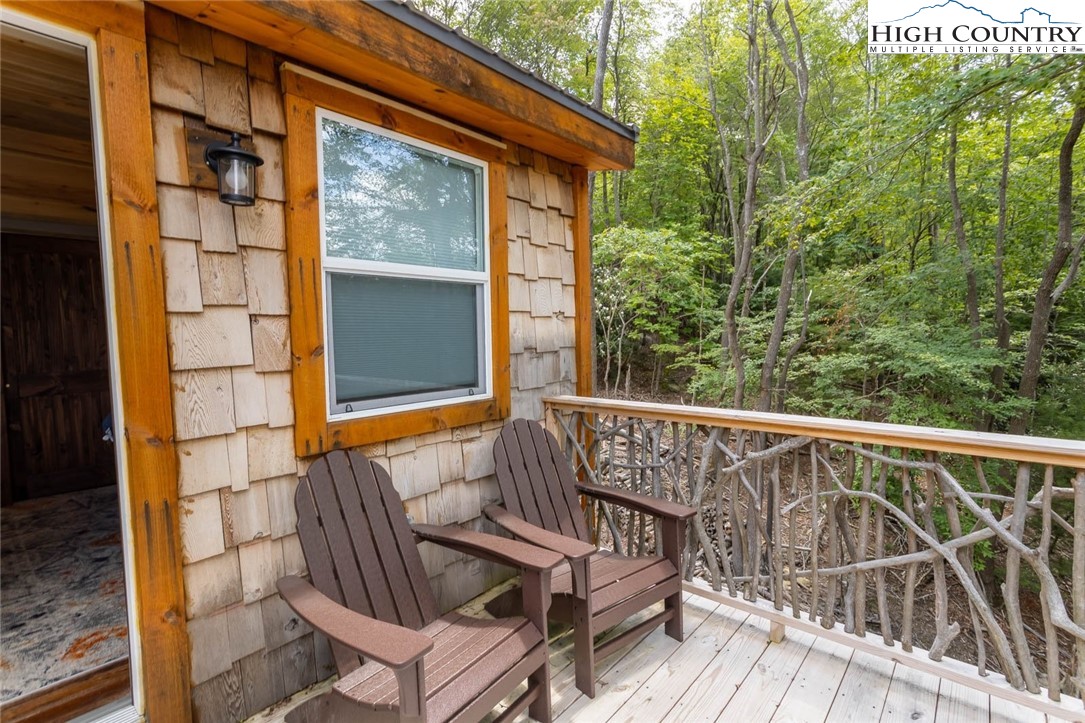 141 Rhododendron Drive Beech Mountain, NC 28604 - Photo 24 of 27 a view of a chair and table on the balcony