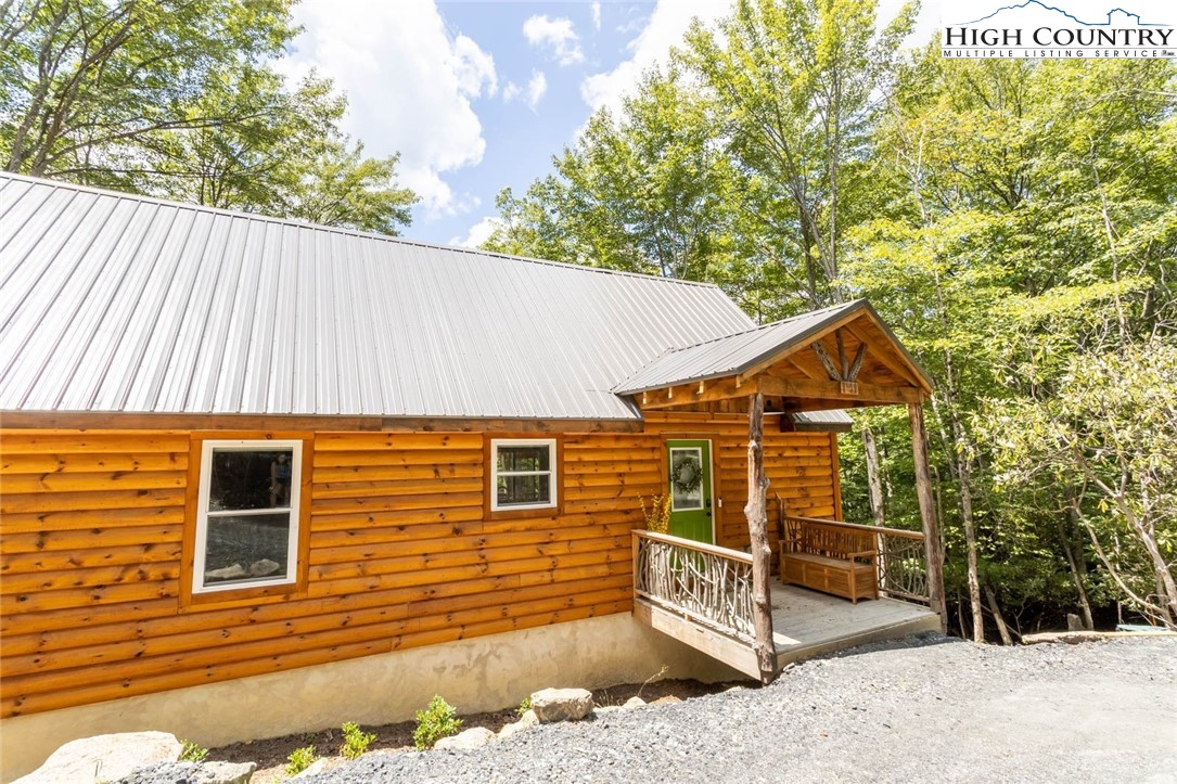 141 Rhododendron Drive Beech Mountain, NC 28604 - Photo 27 of 27 a view of a house with a yard