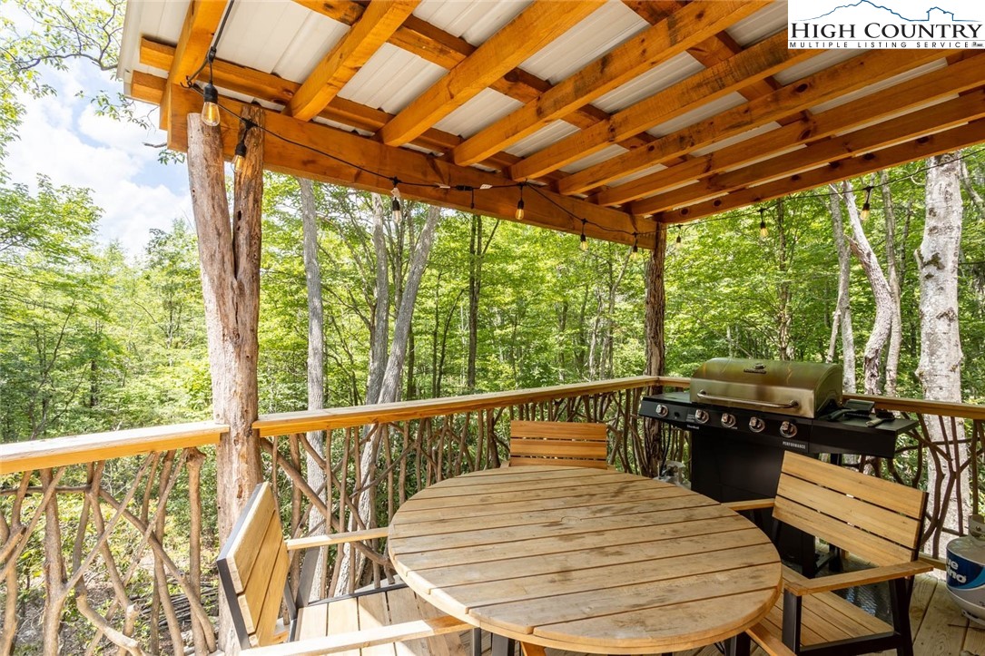 141 Rhododendron Drive Beech Mountain, NC 28604 - Photo 6 of 27 a view of a patio with swimming pool