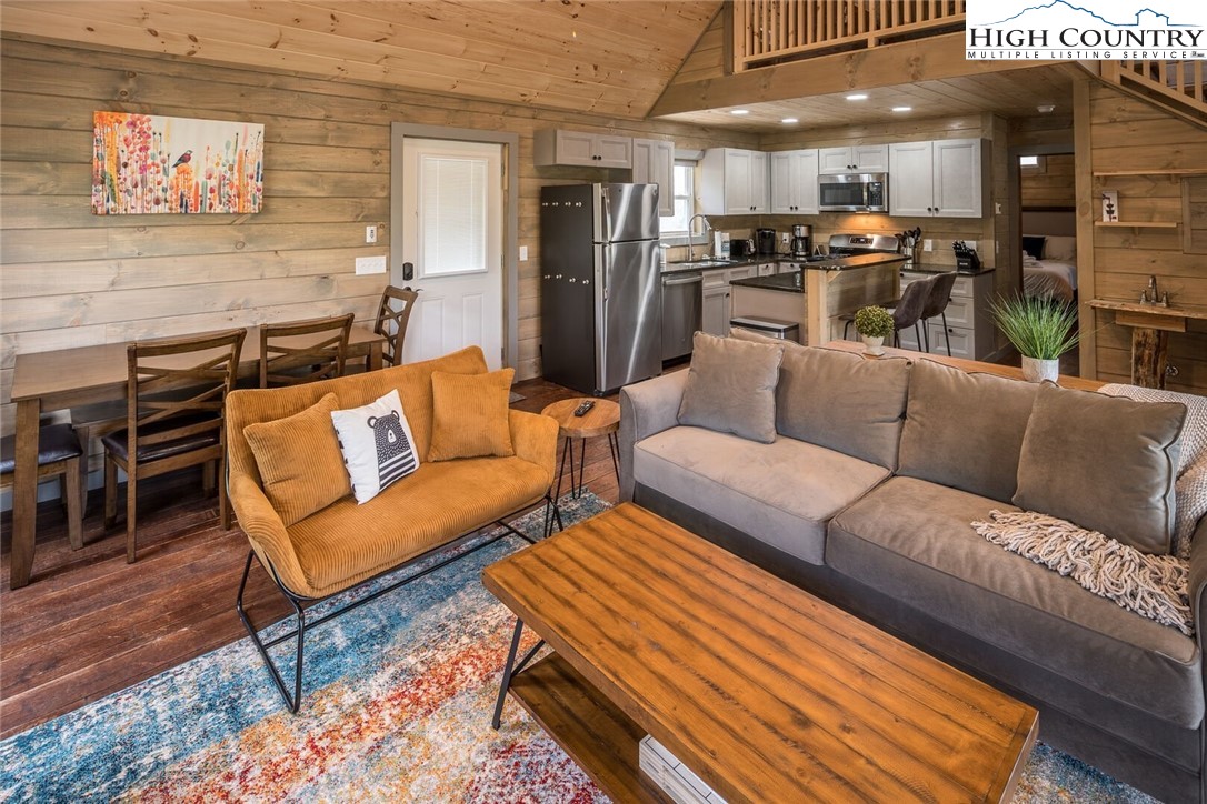 141 Rhododendron Drive Beech Mountain, NC 28604 - Photo 7 of 27 a living room with furniture and kitchen view