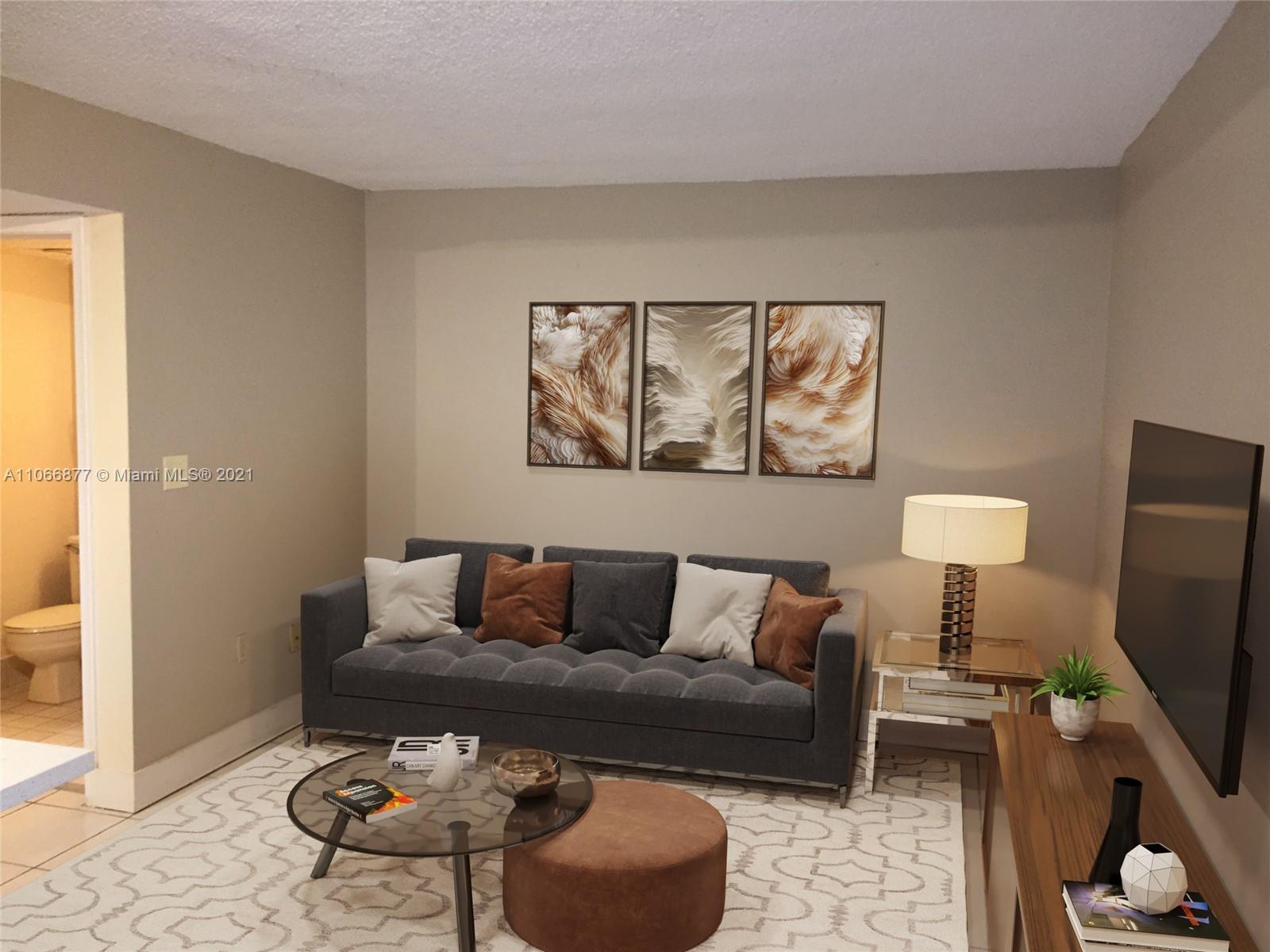 11820 Southwest 80th Street, Unit 312 Miami, FL 33183 - Photo 16 of 43 a living room with furniture a flat screen tv and a window