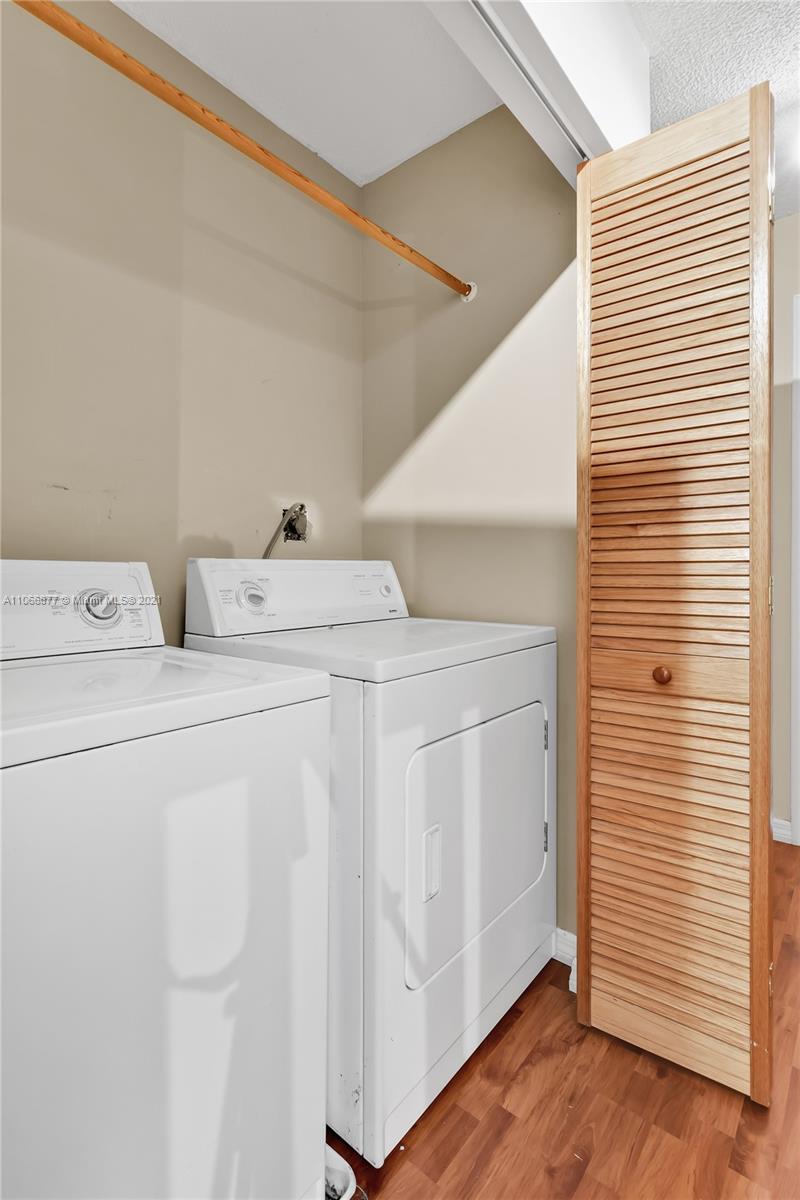 11820 Southwest 80th Street, Unit 312 Miami, FL 33183 - Photo 20 of 43 a utility room with dryer and washer