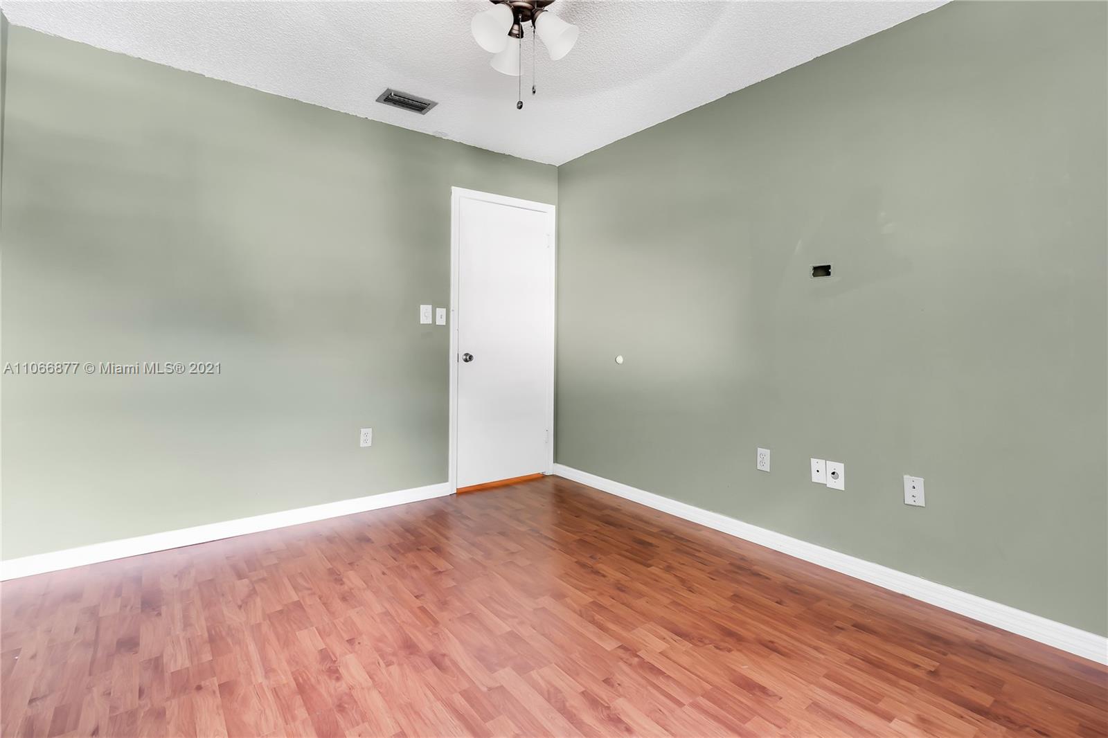 11820 Southwest 80th Street, Unit 312 Miami, FL 33183 - Photo 22 of 43 a view of empty room with wooden floor