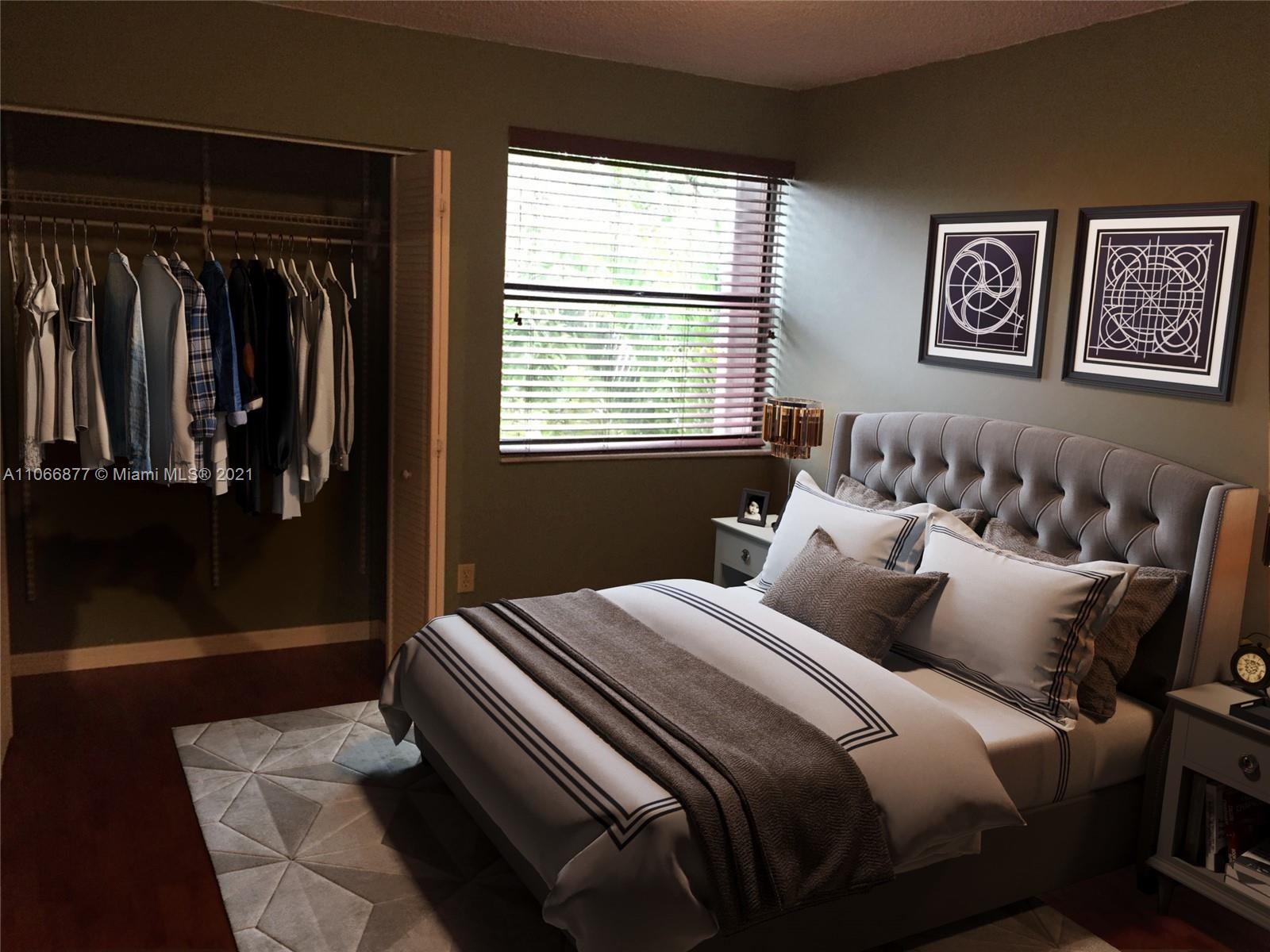 11820 Southwest 80th Street, Unit 312 Miami, FL 33183 - Photo 25 of 43 a bedroom with bed and wooden floor