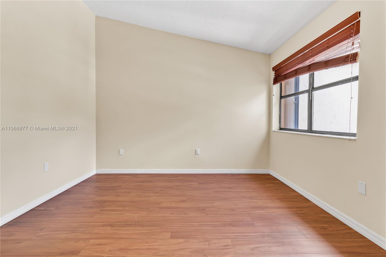 11820 Southwest 80th Street, Unit 312 Miami, FL 33183 - Photo 29 of 43 wooden floor in a room