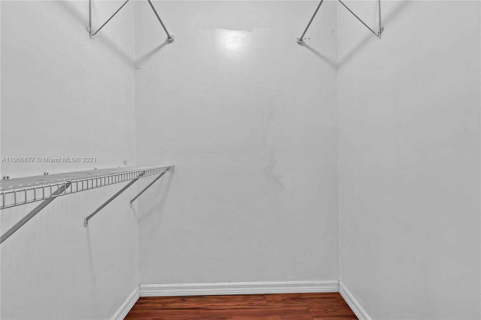 11820 Southwest 80th Street, Unit 312 Miami, FL 33183 - Photo 30 of 43 a view of a room with racks on the wall