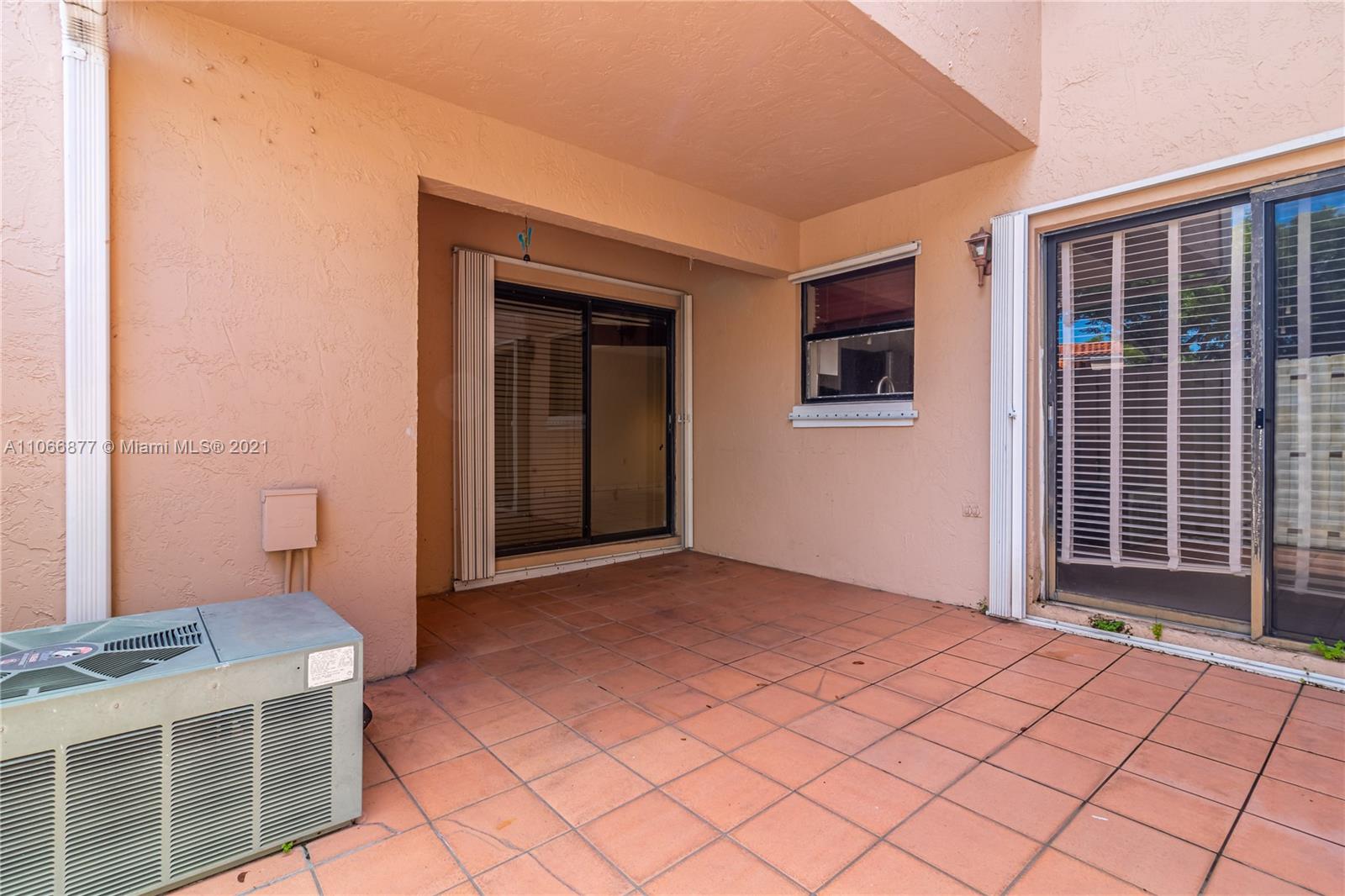 11820 Southwest 80th Street, Unit 312 Miami, FL 33183 - Photo 33 of 43 a view of an empty room with a window