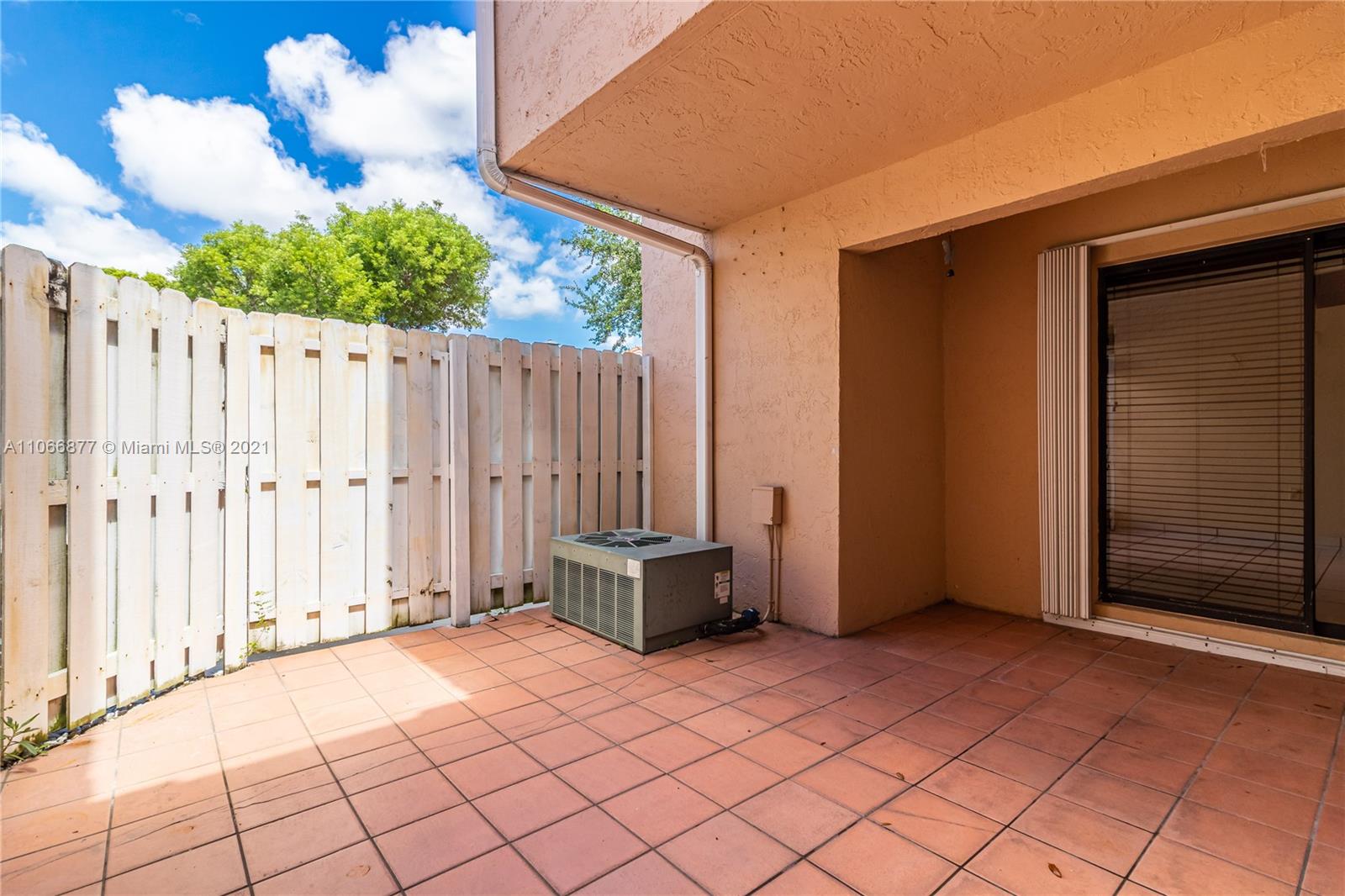 11820 Southwest 80th Street, Unit 312 Miami, FL 33183 - Photo 34 of 43 a view of a backyard