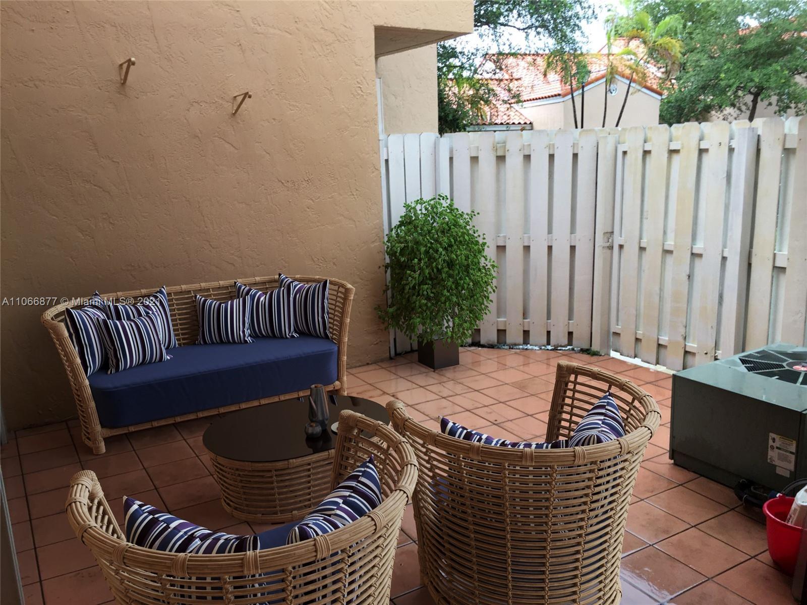 11820 Southwest 80th Street, Unit 312 Miami, FL 33183 - Photo 35 of 43 a view of outdoor space with seating