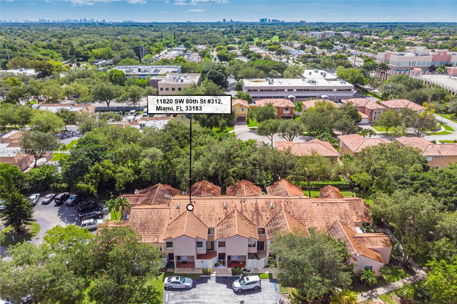 11820 Southwest 80th Street, Unit 312 Miami, FL 33183 - Photo 39 of 43 an aerial view of residential houses with outdoor space and trees